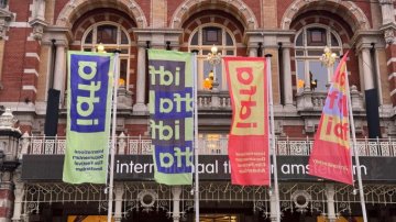 Photo of IDFA banners in front of a museum