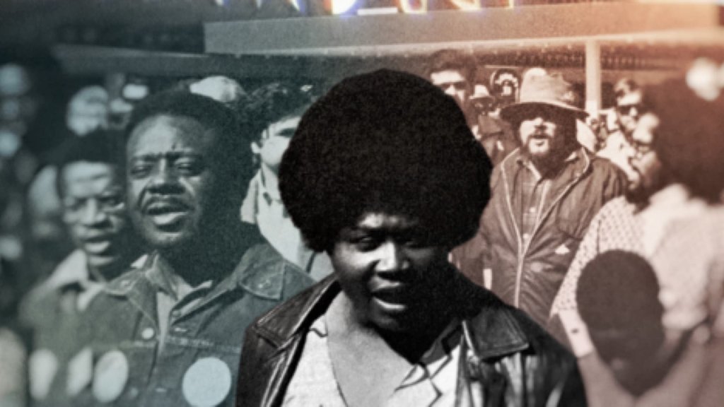 Ruby Duncan in black and white front and center among a group of people