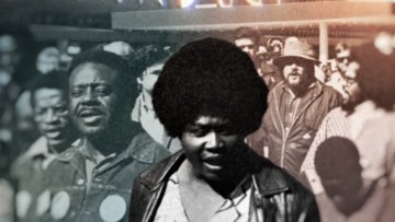 Ruby Duncan in black and white front and center among a group of people