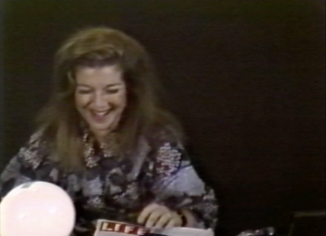 Joan Braderman working on set, behind-the-scenes